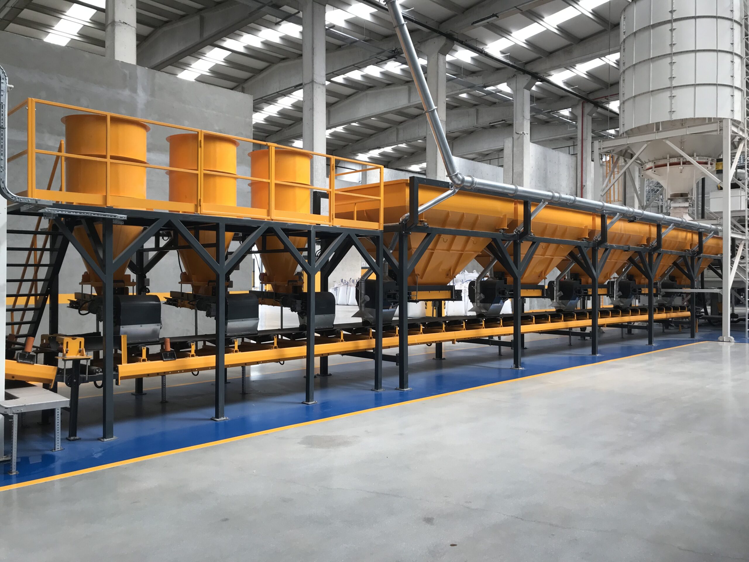 Modular fertilizer blending and dosing line inside an industrial production facility